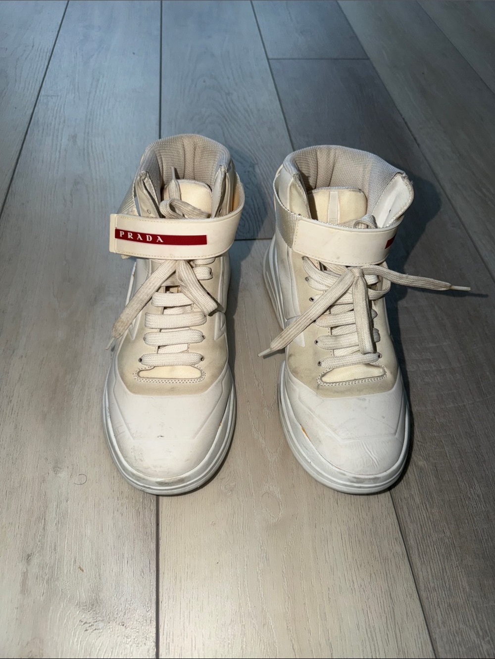 Prada White High-Top Sneakers with Red Logo Strap